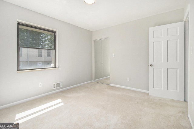6437 Stone Way, Morrow, GA 30260 - unfurnished bedroom featuring carpet flooring, baseboards, visible vents, and a closet