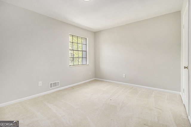 6437 Stone Way, Morrow, GA 30260 - unfurnished room with light colored carpet, a textured ceiling, visible vents, and baseboards