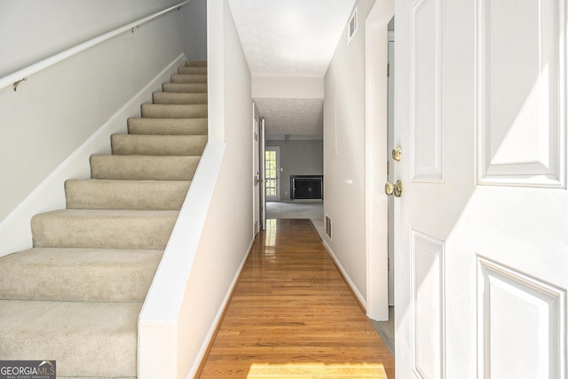 6437 Stone Way, Morrow, GA 30260 - staircase featuring baseboards, visible vents, and wood finished floors