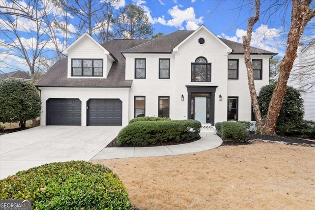 view of front facade featuring concrete driveway, a shingled roof, an attached garage, and brick siding