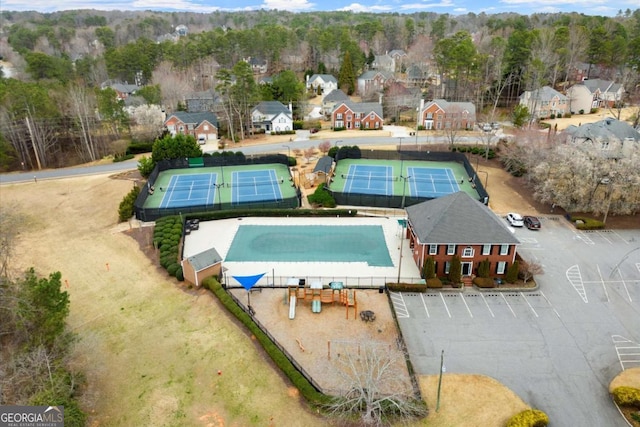 view of pool with a residential view