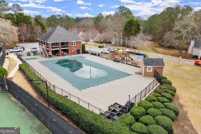 view of swimming pool with fence