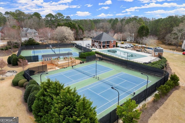 view of sport court with fence