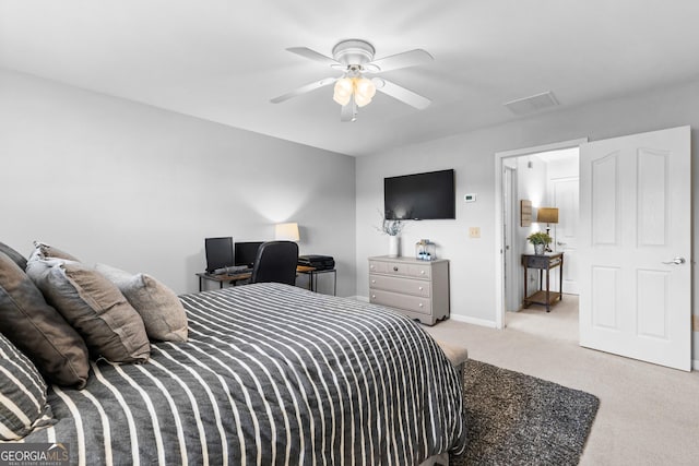 bedroom with baseboards, a ceiling fan, visible vents, and light colored carpet