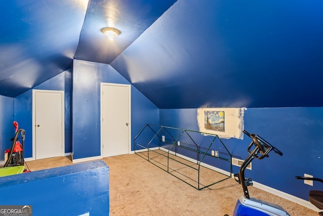 playroom featuring carpet floors, lofted ceiling, and baseboards