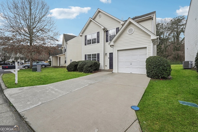 traditional-style house with a garage, a front yard, driveway, and central AC unit