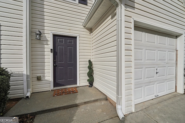 view of exterior entry featuring a garage