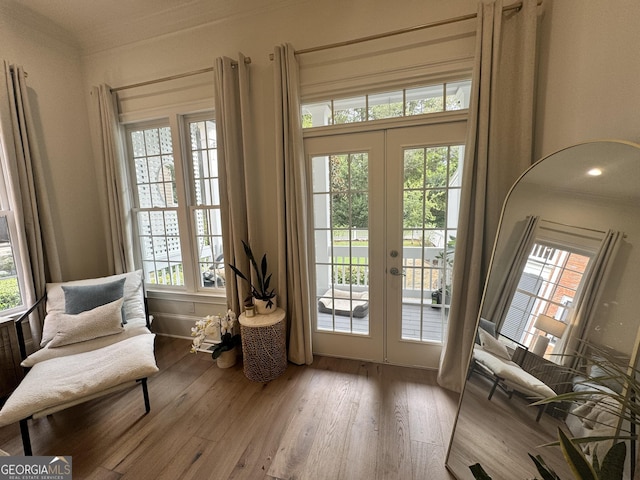 sitting room with french doors and wood finished floors