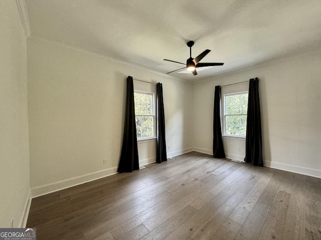 unfurnished room featuring baseboards, wood-type flooring, and a healthy amount of sunlight