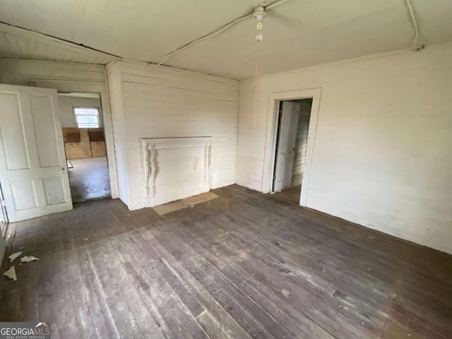 unfurnished room featuring wood-type flooring