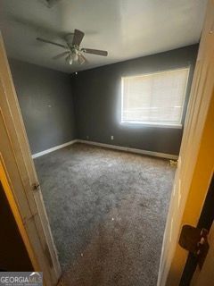 405 Fairburn Rd SW Unit 107, Atlanta, GA 30331 - carpeted empty room with baseboards and a ceiling fan