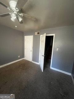 405 Fairburn Rd SW Unit 107, Atlanta, GA 30331 - unfurnished bedroom featuring dark colored carpet and a ceiling fan