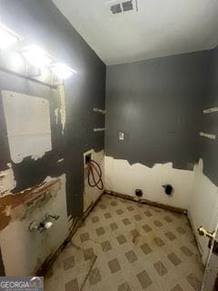 405 Fairburn Rd SW Unit 107, Atlanta, GA 30331 - laundry room featuring light flooring