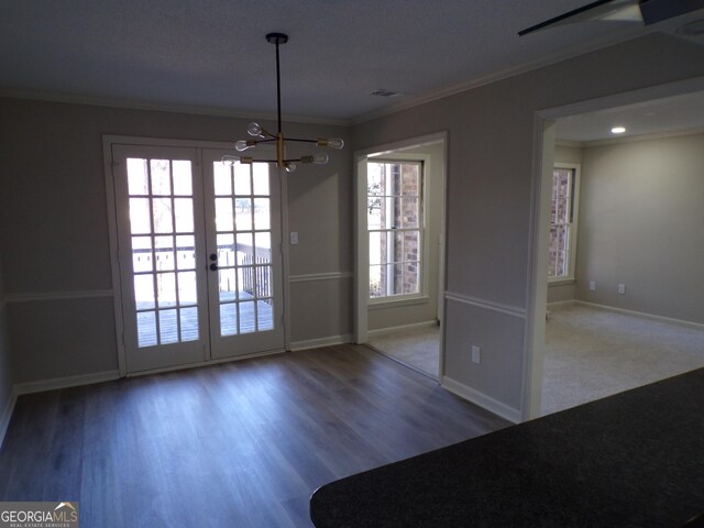 2401 Northlake Ct, Atlanta, GA 30345 - unfurnished dining area with wood finished floors, visible vents, baseboards, an inviting chandelier, and ornamental molding