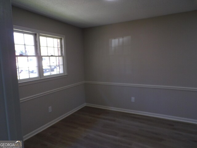 2401 Northlake Ct, Atlanta, GA 30345 - empty room with baseboards and dark wood-style flooring