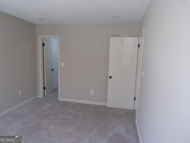 2401 Northlake Ct, Atlanta, GA 30345 - unfurnished bedroom with carpet flooring and baseboards