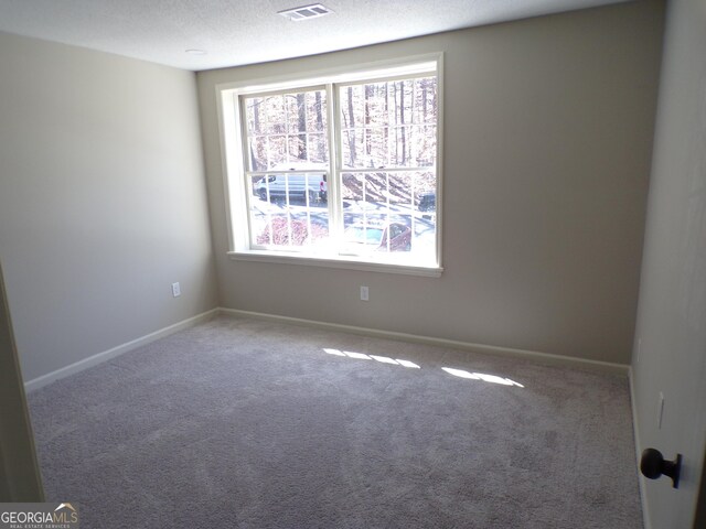 2401 Northlake Ct, Atlanta, GA 30345 - empty room with baseboards, visible vents, a textured ceiling, and carpet