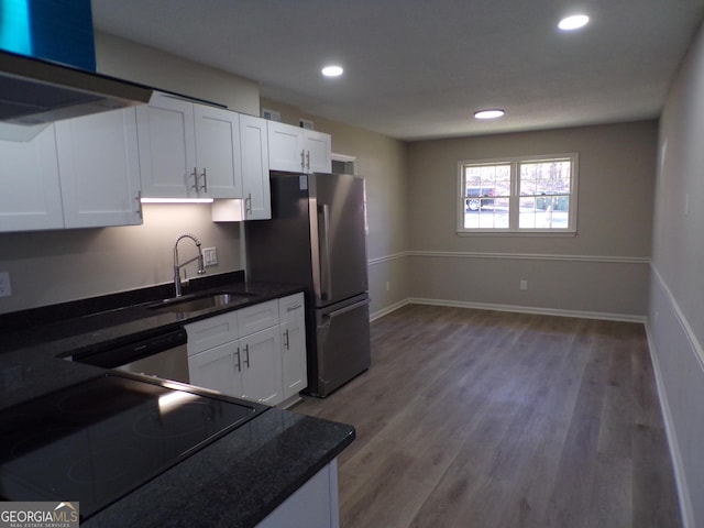 2401 Northlake Ct, Atlanta, GA 30345 - kitchen featuring a sink, ventilation hood, stainless steel appliances, white cabinets, and light wood finished floors