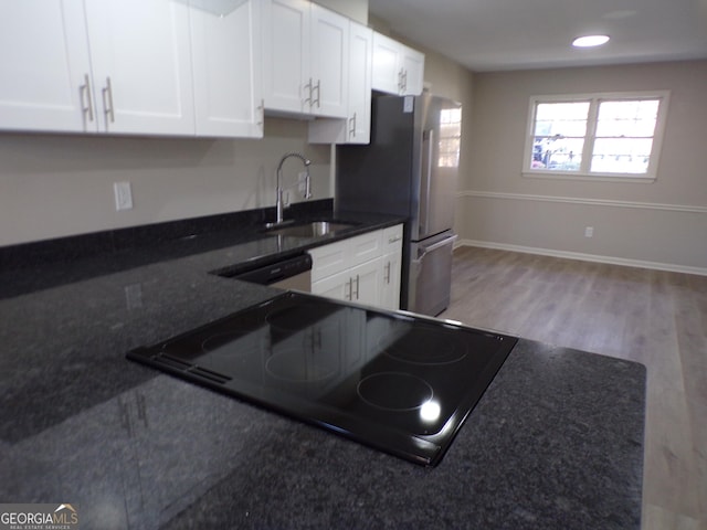 2401 Northlake Ct, Atlanta, GA 30345 - kitchen featuring a sink, light wood-style floors, white dishwasher, and white cabinetry