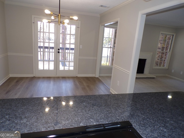 2401 Northlake Ct, Atlanta, GA 30345 - interior space with visible vents, crown molding, french doors, a fireplace, and a notable chandelier