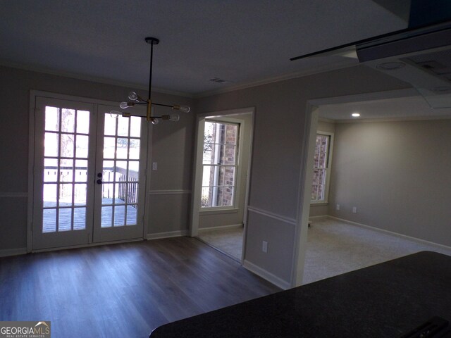 2401 Northlake Ct, Atlanta, GA 30345 - unfurnished dining area featuring crown molding, baseboards, a chandelier, french doors, and wood finished floors