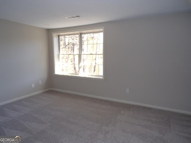 2401 Northlake Ct, Atlanta, GA 30345 - unfurnished room featuring visible vents, baseboards, and carpet flooring