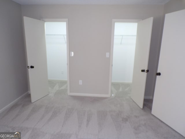 2401 Northlake Ct, Atlanta, GA 30345 - unfurnished bedroom featuring a walk in closet, carpet flooring, and a closet