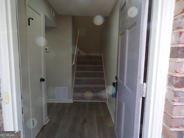 2401 Northlake Ct, Atlanta, GA 30345 - stairway featuring visible vents, baseboards, and wood finished floors