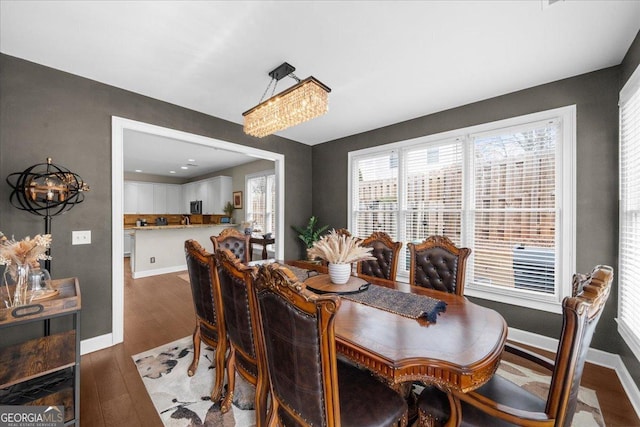 dining room with wood finished floors and baseboards