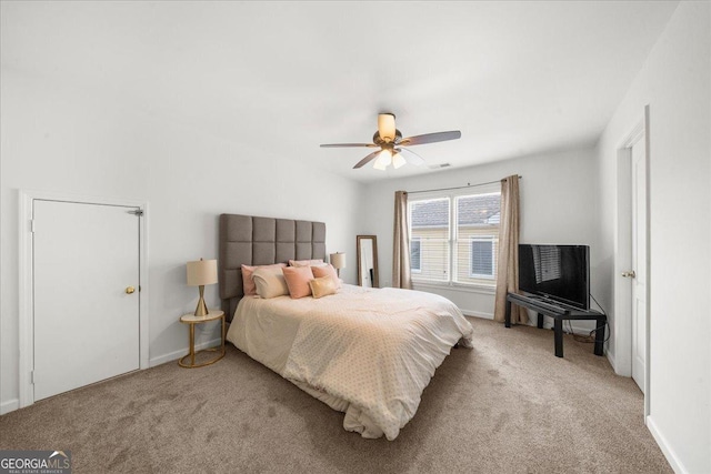 bedroom with a ceiling fan, light carpet, visible vents, and baseboards