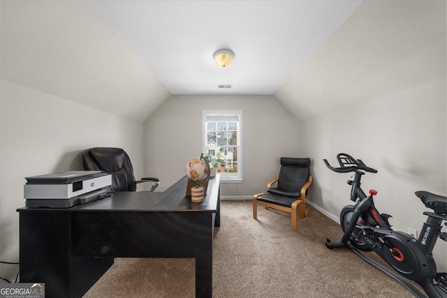 carpeted office with vaulted ceiling, visible vents, and baseboards