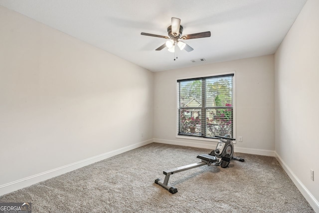 workout room featuring visible vents, baseboards, carpet, and ceiling fan