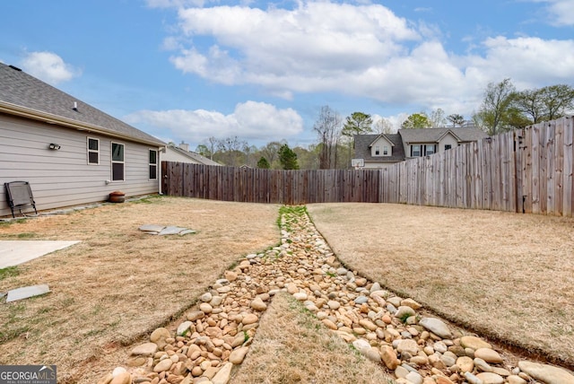 view of yard featuring a fenced backyard