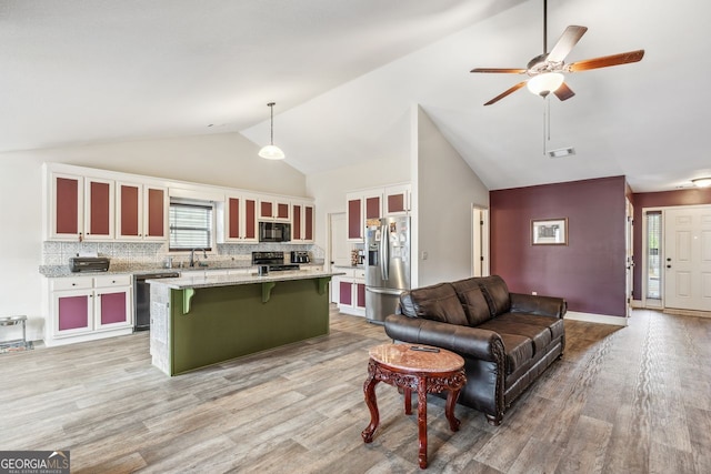 living area with a ceiling fan, visible vents, baseboards, high vaulted ceiling, and light wood-type flooring