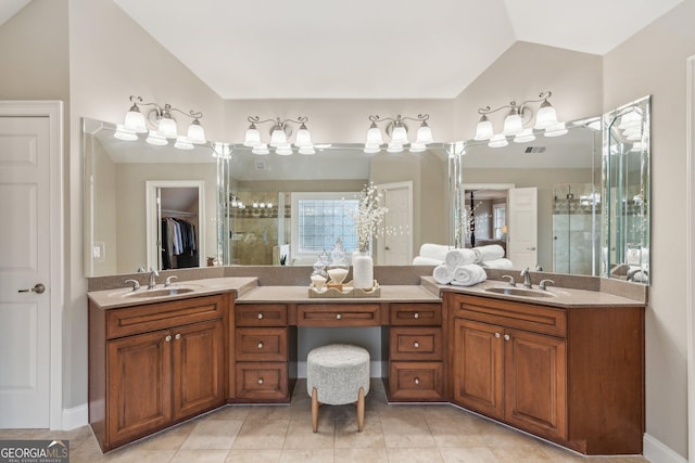 full bathroom featuring a sink, visible vents, a stall shower, and vaulted ceiling