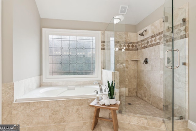 full bathroom with visible vents, a bath, and a shower stall