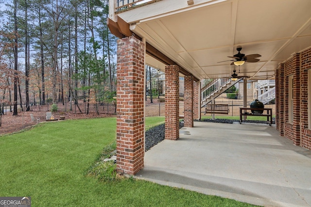 view of patio featuring stairway and ceiling fan