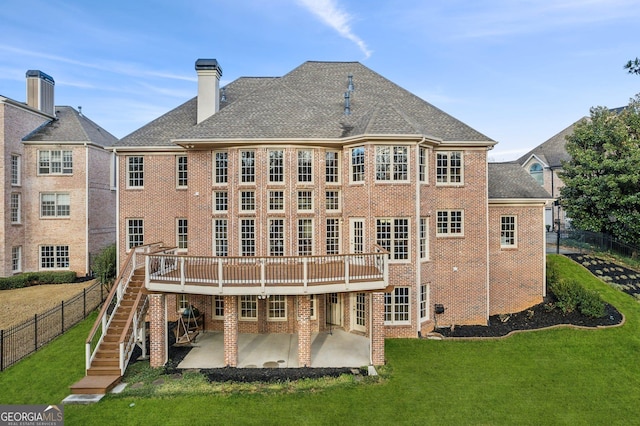 back of property featuring a patio, stairway, a yard, and brick siding