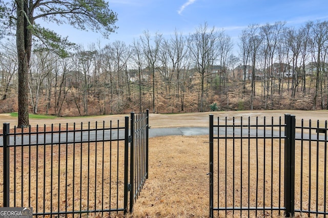 view of gate featuring fence