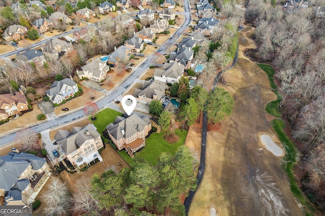 birds eye view of property with a residential view