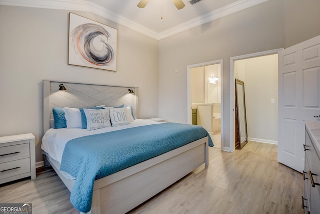 bedroom with visible vents, baseboards, ornamental molding, ensuite bathroom, and light wood-type flooring