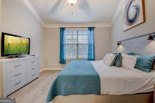 bedroom featuring a ceiling fan, crown molding, baseboards, and light wood-type flooring