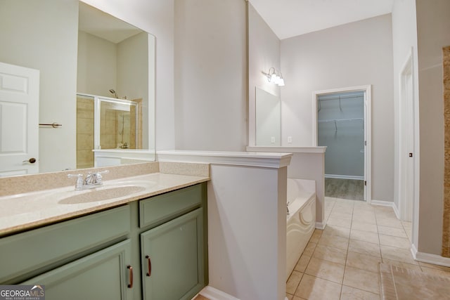 1910 Cedar Glenn Unit 4401, Atlanta, GA 30339 - bathroom with a garden tub, vanity, a stall shower, tile patterned floors, and baseboards