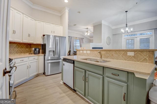 1910 Cedar Glenn Unit 4401, Atlanta, GA 30339 - kitchen featuring stainless steel appliances, a sink, white cabinets, ornamental molding, and backsplash