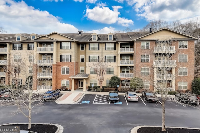 1910 Cedar Glenn Unit 4401, Atlanta, GA 30339 - view of apartment building / complex featuring uncovered parking