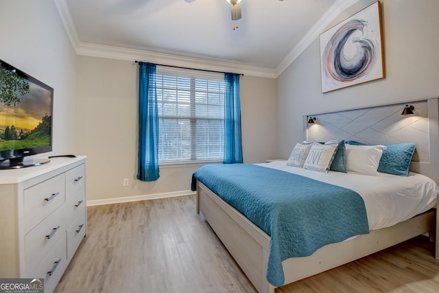 bedroom featuring light wood-type flooring, crown molding, and baseboards