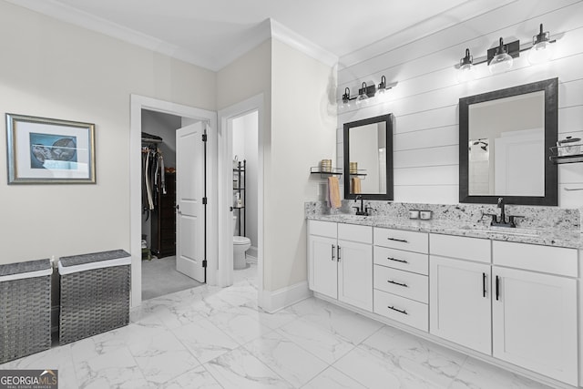 full bathroom featuring a sink, marble finish floor, and ornamental molding