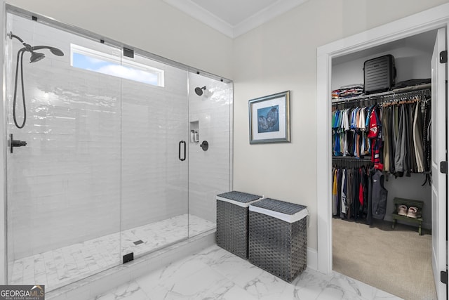 full bath with a spacious closet, a stall shower, marble finish floor, and ornamental molding