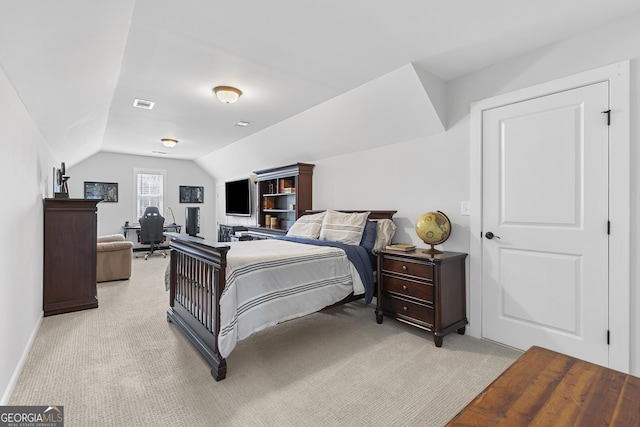 bedroom featuring visible vents, light colored carpet, baseboards, and lofted ceiling