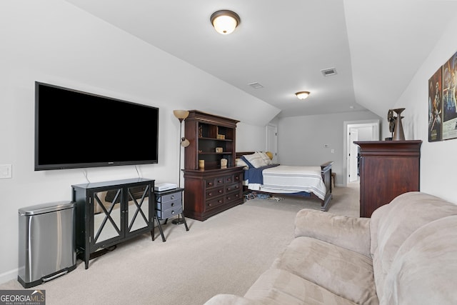 carpeted bedroom with visible vents, baseboards, and vaulted ceiling